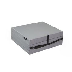 a silver box with black straps on the lid and bottom is shown in front of a white background