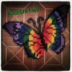 an image of a colorful butterfly made out of perler beads