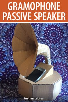 an open cardboard box with a phone in it and the words gramphone passive speaker