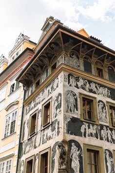 an old building with some paintings on it