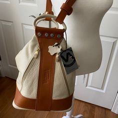 Valentina Convertible Backpack Sling Purse Made In Italy New With Tags, Perfect Condition Never Used Or Carried Gorgeous Creamy Pebbled Leather With Saddle Brown Accents 2 Main Zippered Compartments With One Zippered And Two Open Pockets On The Interior. To Outside Zippered Pockets. Protective Metal On Bottom. Carry As A Sling Purse Or Backpack Option. Remove Strap To Use Leather Carry Handles Sling Purse, Travel Guide London, Convertible Backpack, Convertible Bags, Saddle Brown, Bag Pattern, Pebbled Leather, Saddle, Travel Guide