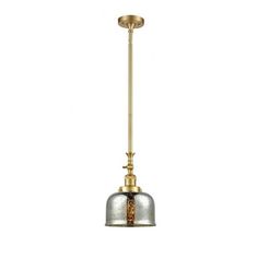 an antique brass and silver pendant light