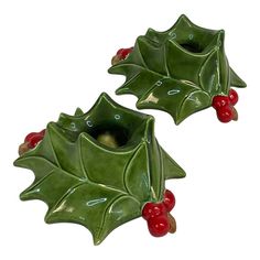 two green ceramic holly planters with red berries