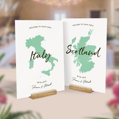 two cards with the names and map of scotland on them, sitting next to each other