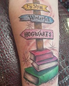 a person with a tattoo on their arm that says, the shire winterfell hogwarts