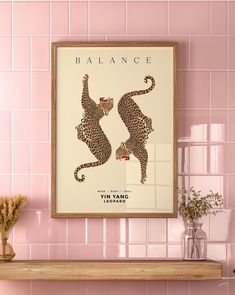 a pink tiled wall with two leopards on it and the words balance above them