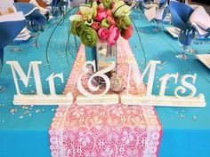 the table is decorated with blue and pink flowers