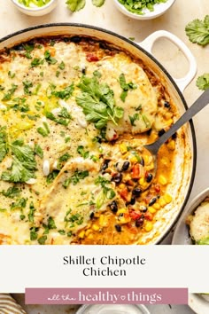 a skillet with chicken, black beans and cilantro in it next to other dishes