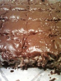 a close up of a cake with chocolate frosting