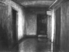 a black and white photo of an empty hallway