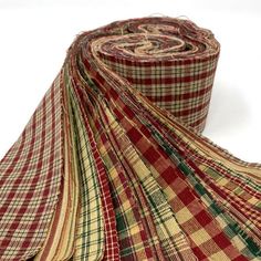 a roll of red and yellow plaid fabric