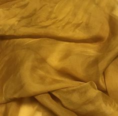 the fabric is very soft and yellow in this photo, it looks like something out of an old book