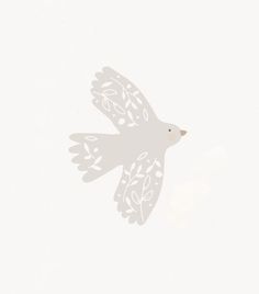 a white bird flying through the sky