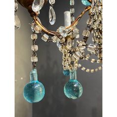 a chandelier with blue glass beads hanging from it