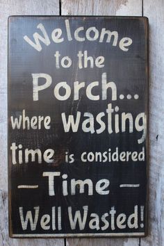 a wooden sign that reads welcome to the porch where washing time is considered time well wasted