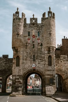 an old stone gate with crosses on it