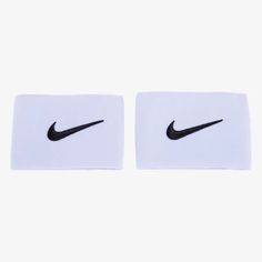 two white napkins with black nike logo on them