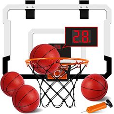 basketballs and an electronic clock on a white background