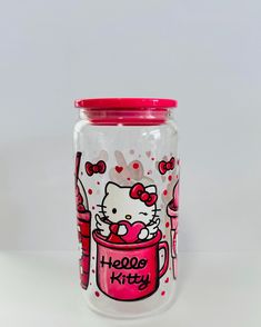 a hello kitty glass jar with pink lid