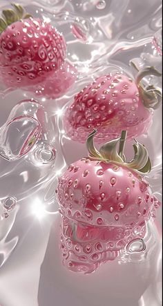 three pink strawberries sitting on top of water