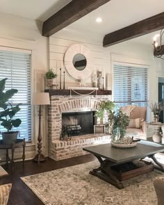 a living room filled with furniture and a fire place