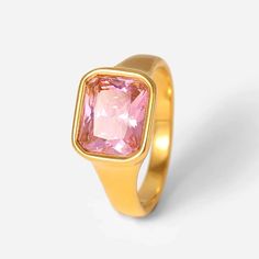 Introducing the Forza Gold Pink Gemstone Signet Ring, a dazzling fusion of elegance and modern style. Crafted from high-quality stainless steel with a luxurious 18 karat gold finish, this ring exudes sophistication. The on-trend square-ish design, paired with a sparkling array of gemstone options including black, clear, pink, and green zircons, adds a touch of glamour to any ensemble. Whether you're looking for a statement piece or a stylish gift, the Forza Gold Gemstone Signet Ring is a radiant choice that seamlessly blends timeless charm with contemporary flair. Stylish Rings, Resin Ring, Amethyst Purple, Purple Stones, Pink Gemstones, Stylish Gifts, Signet Ring, Layered Necklaces, Gold Vermeil