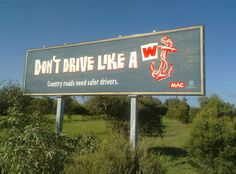 a large sign that says don't drive like a w