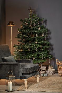 a living room with a christmas tree in the corner