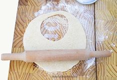 a rolling pin on top of a wooden table