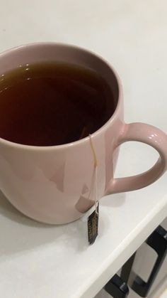 a cup of tea sitting on top of a counter