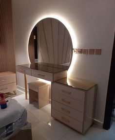 a bedroom with a vanity and mirror in it