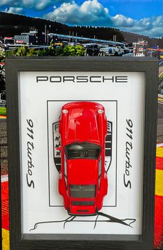 a red car is in a black frame