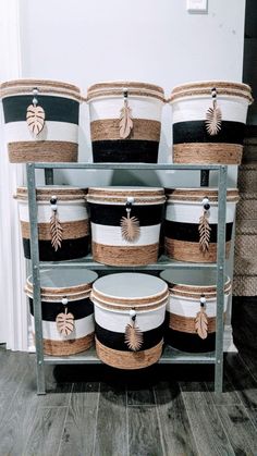 several black and white buckets stacked on top of each other