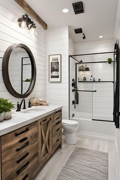 a bathroom with white walls and wood accents