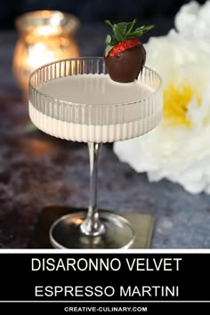 a chocolate covered strawberry sitting on top of a martini in a coupe glass with the words disaranono velvet espresso martini