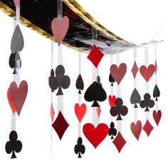 a card game with hearts and spades hanging from the wall