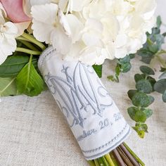 a bouquet of white flowers sitting on top of a table