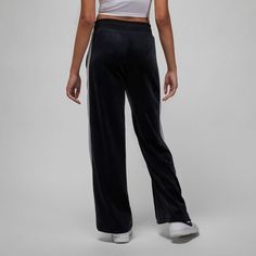 Style No. DV1404-010 Color: Black/Cement Grey/Sail A ribbed waistband and roomy legs add to the cushy comfort in these velour pants. Ribbed waistband with drawstring offers you a comfortable fit. 94% Polyester/6% Spandex. Jordan Flight Women's Velour Pants. Air Jordans Women, Sporty Pants, Jumpman Logo, Velour Pants, Black Cement, Jordans Women, Cement Gray, Cement, Air Jordan