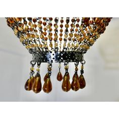 a chandelier with many beads hanging from it