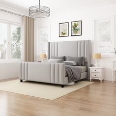 a bedroom with white walls and wooden floors