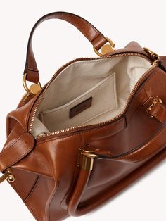 Chloé Small Paraty 24 Bag In Soft Leather | Chloé US Brown Satchel With Gold-tone Hardware And Round Handle, Brown Satchel With Round Handle And Gold-tone Hardware, Luxury Cognac Satchel With Gold-tone Hardware, Cognac Top Handle Bag With Metal Hardware, Brown Accessories, Bag Collection, Brands Luxury, Hand Bag, Order Online