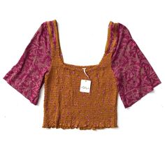 This Listing Is For A Free People Top. Please See Details Below: It Is New, With The Tag. The Label Has A Small Red Dot On It. Color Is Golden Combo 60% Cotton And 40% Modal Smocked Bohemian Pink Top With Smocked Back, Pink Top With Smocked Back For Spring, Pink Bohemian Smocked Top For Summer, Multicolor Casual Smocked Short Sleeve Top, Casual Multicolor Top With Smocked Bodice, Trendy Short Sleeve Top With Smocked Back, Pink Cotton Blouse With Smocked Back, Pink Cotton Smocked Top, Casual Multicolor Smock Tops