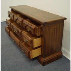 a large wooden dresser with drawers on it