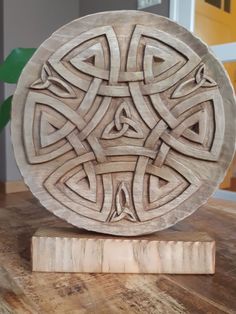 a wooden plate sitting on top of a table