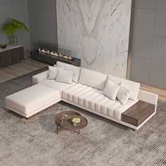 a living room with a large sectional couch and coffee table in front of a fireplace