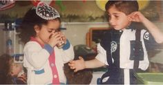 two young children standing next to each other