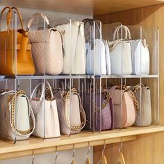 a shelf filled with lots of purses on top of wooden shelves next to each other