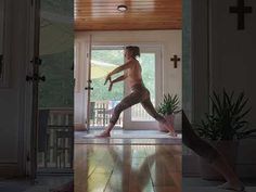 a shirtless man standing in front of a door with his arms spread wide open