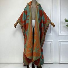 This super soft and warm wool cardigan kimono is perfect for the cold weather. Unlike other sweaters and wools, the wool used for this beauty is non itchy. Think of your favorite throw blanket, the comfort and warmth it gives but 10x stylish and wearable any where. This kimono is all that and more! One size fits S-4X Material: Wool One Size Fits Most Size Chart Cozy Long Acrylic Outerwear, Cozy Long-sleeve Winter Cape, Cozy Long Sleeve Winter Cape, Cozy Winter Cape, One Size Fall Cape Shawl, One Size Cape Shawl For Fall, Fall Cape Shawl One Size, Winter Soft Knit Sweater Coat One Size, One Size Soft Knit Sweater Coat For Winter