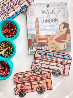 the children's book walk in london is next to two bowls of crayons